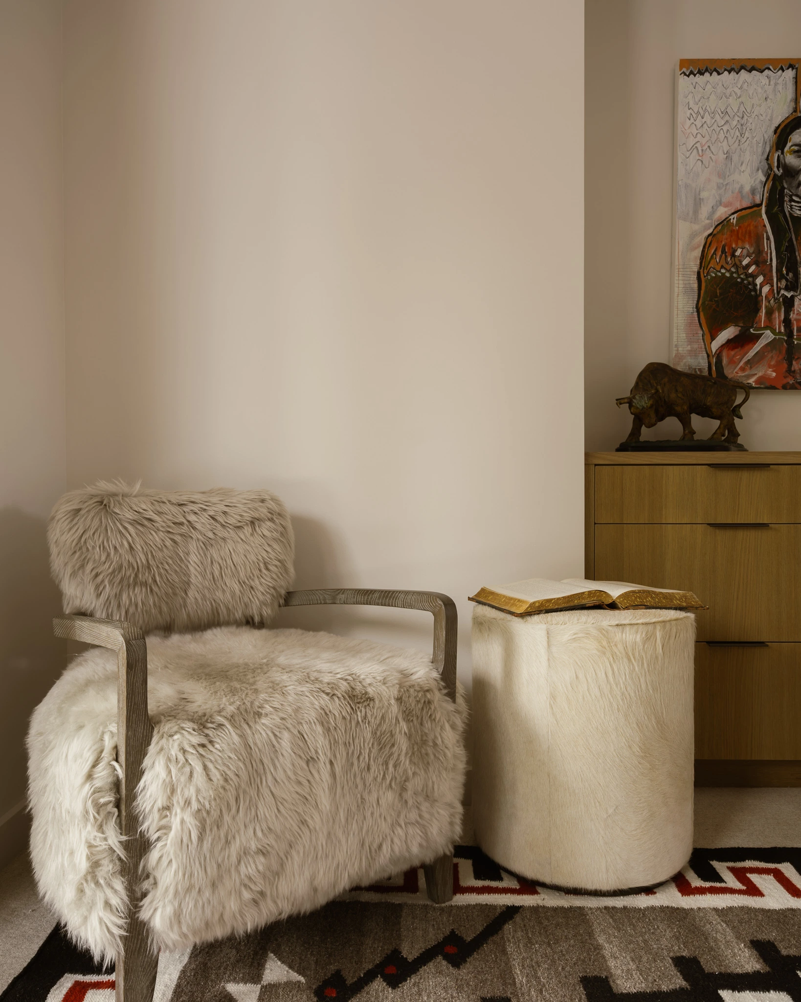 Shearling armchair and ottoman detail — interior design photography Big Sky Montana, Speedwell Cabin
